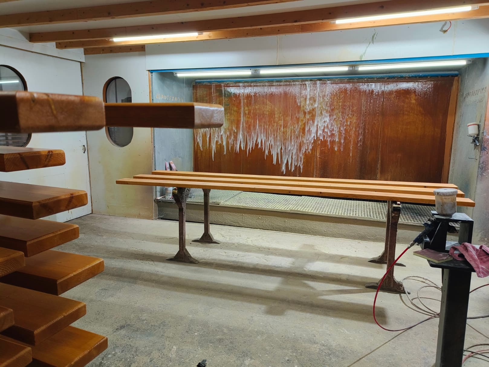 Custom wood pieces in the NtinosFurniture finishing workshop